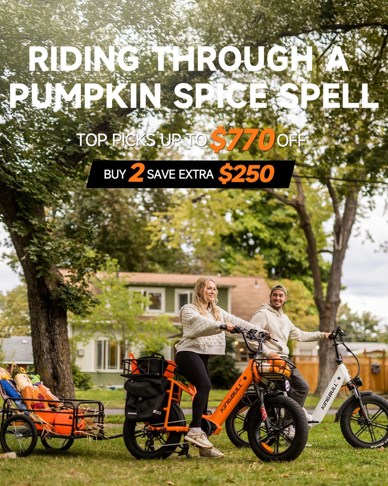 One woman riding orange Kingbull Voyager 2.0 electric bike and a man riding white Kingbull Literider 2.0 electric bikes in suburban backyard with dog - Pumpkin Spice promotion up to $770 off, buy 2 save $250