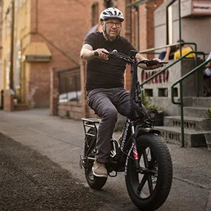 A man rides the Kingbull Literider on the road