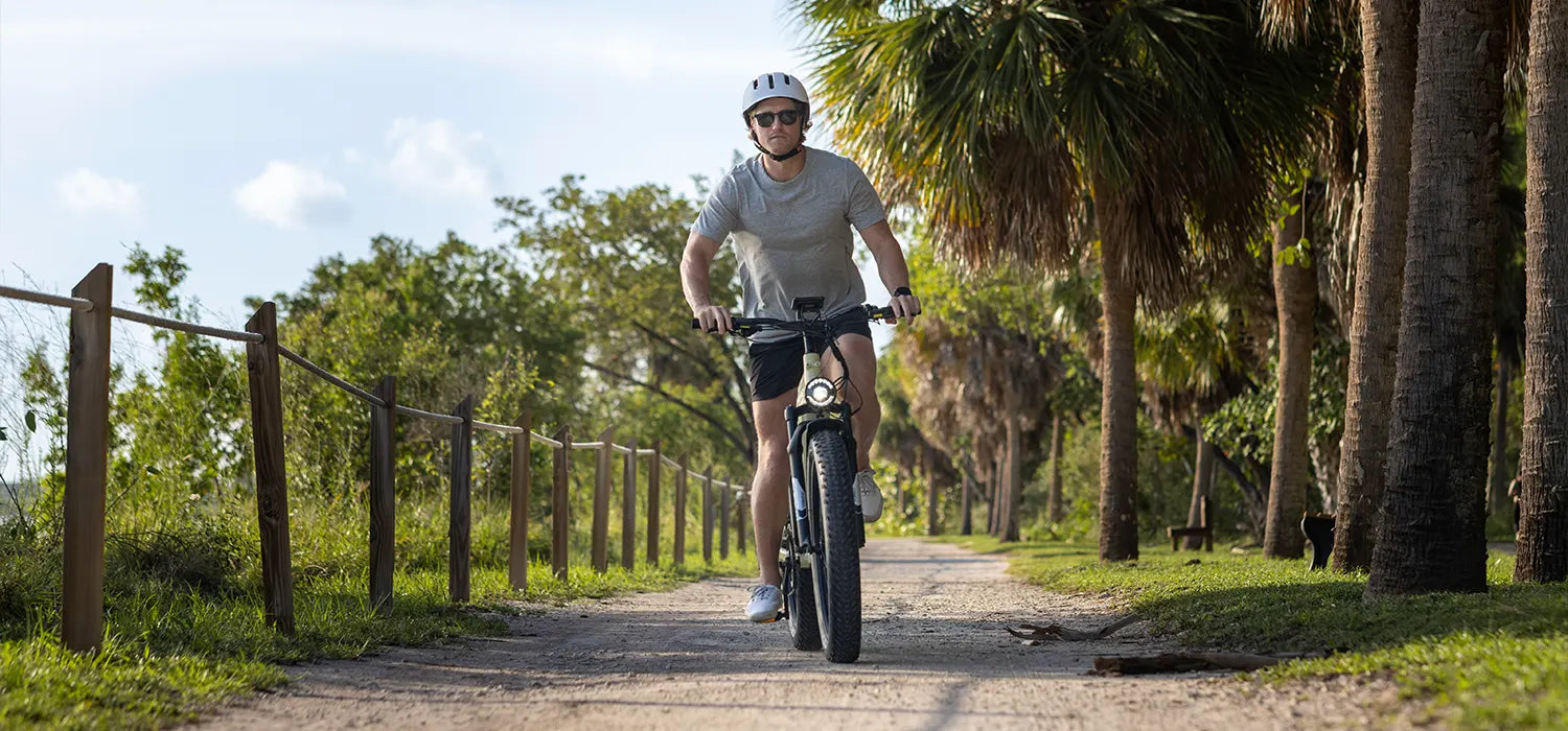 A man is riding a kingbull electric bike quickly trekker