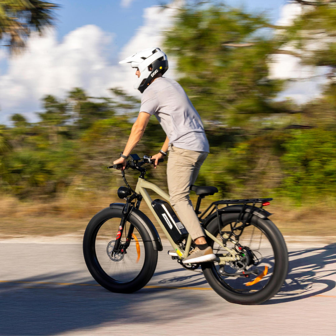 A man cyclist riding Kingbull Hunter 2.0 electric mountain bike on the path
