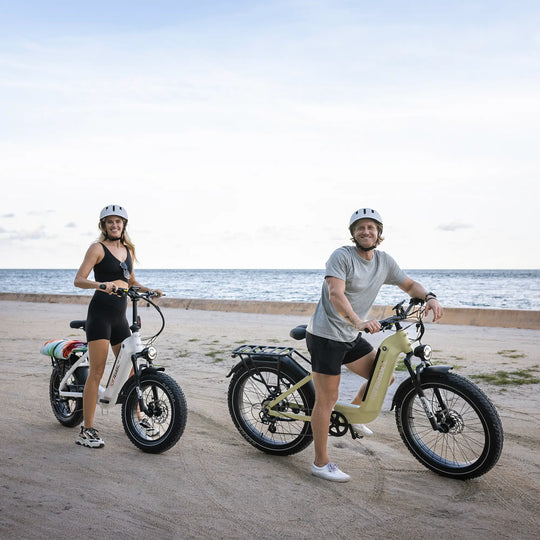 A man and a woman on the beach with their kingbull electric bike