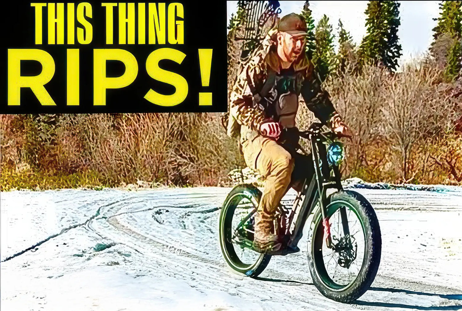 Rider performing dynamic maneuvers on Kingbull Rover 2.0 electric bike in snowy winter terrain - This Thing Rips!