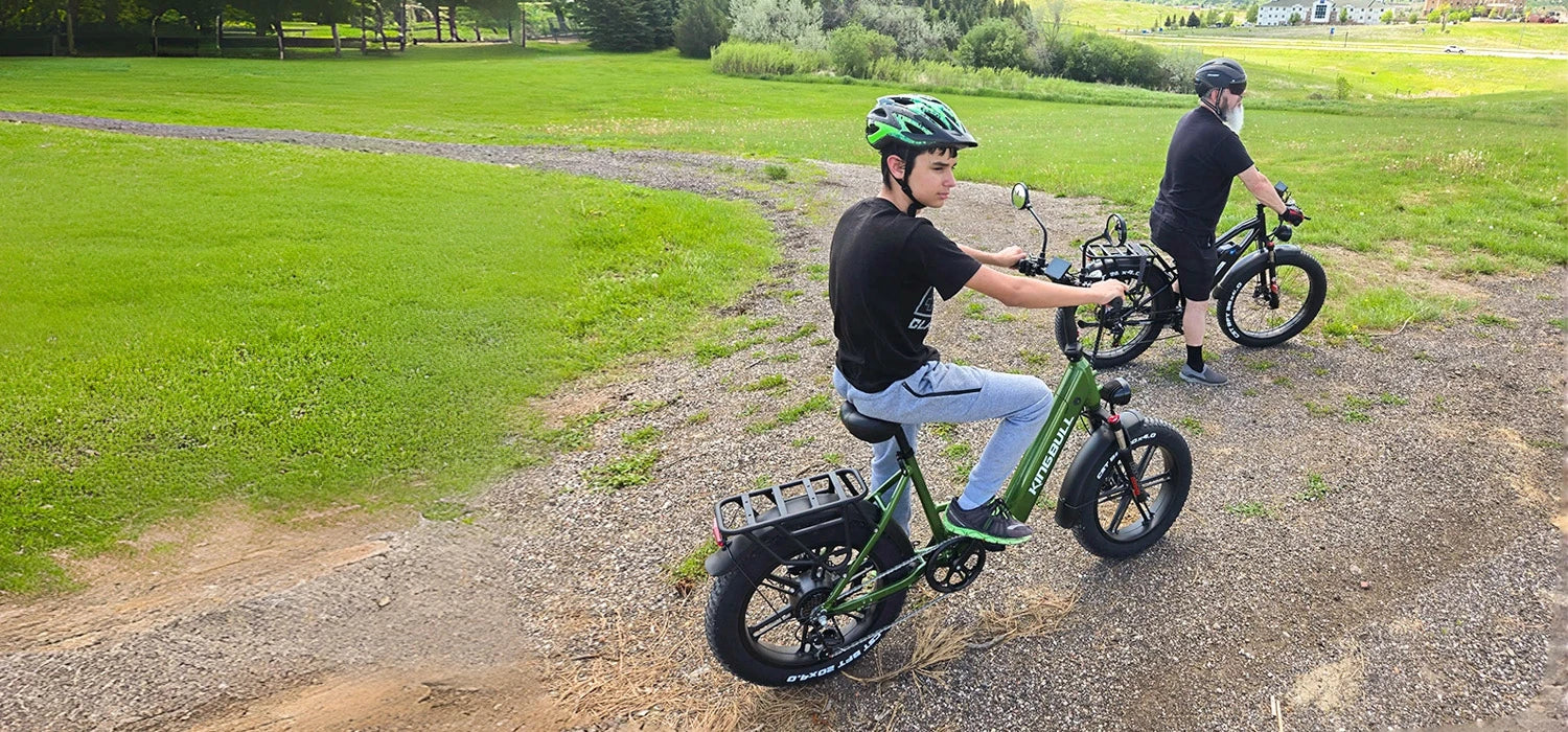 Father and son both ride kingbull electric bikes on the lawn