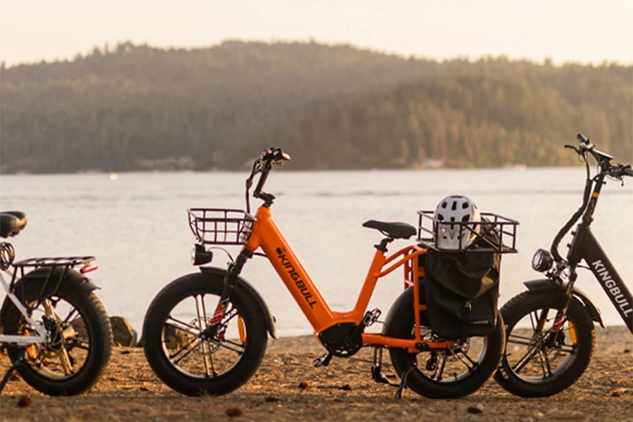 The orange freight electric bicycle kingbull voyager 2.0 is equipped with front and rear baskets and saddle bags, which can carry many items.