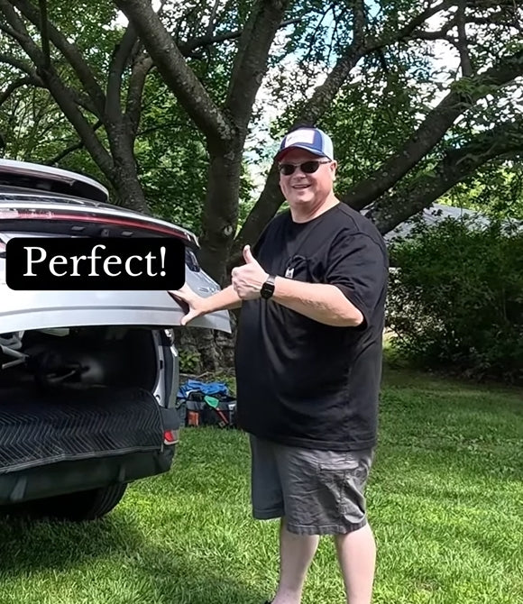 The trunk is filled with kingbull electric bicycle, the man gives a thumbs up.