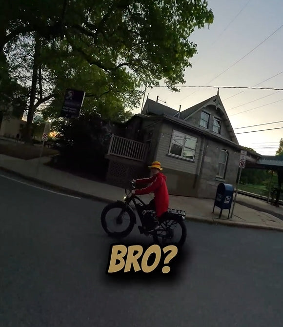 Boy riding an electric bicycle in the city