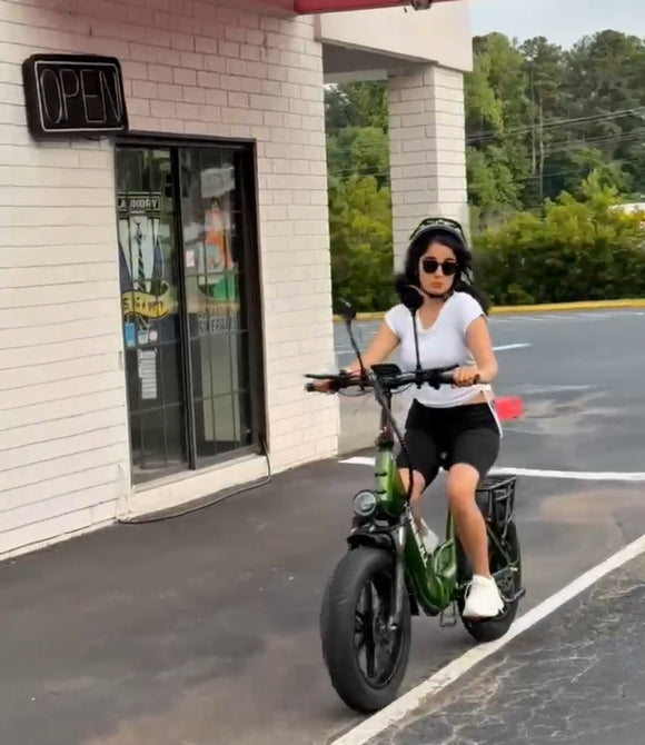 Lady riding green kingbull folding electric bike