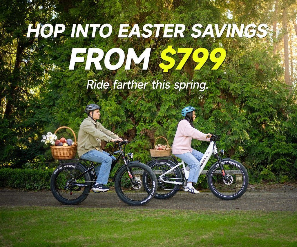 Couple riding Kingbull Hunter 2.0 and Kingbull Discover ST 2.0 fat tire electric bikes with Easter baskets in a lush green park — Easter sale starting from $799