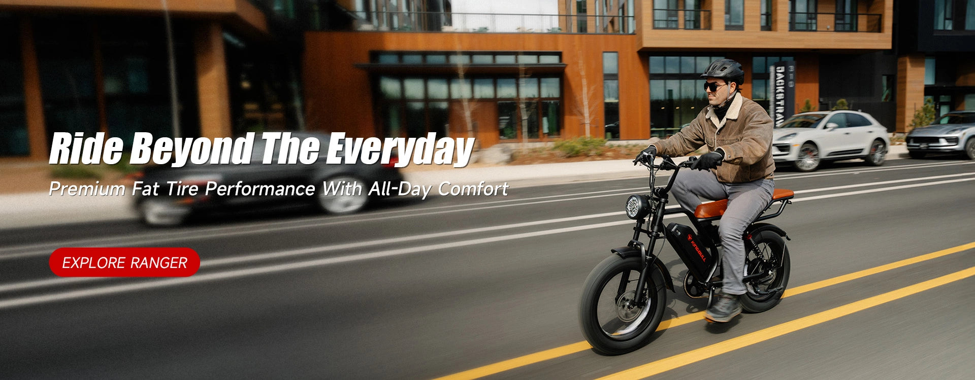 Person riding Kingbull Ranger Vintage electric bike on a road with promotional text about premium fat tire performance.