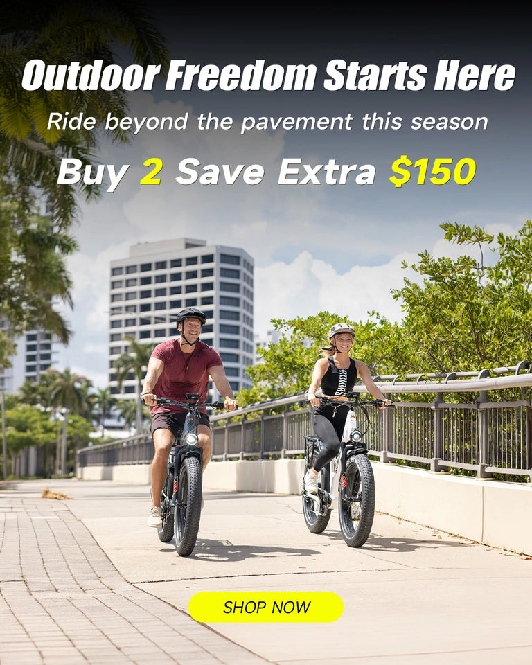 Two people riding Kingbull Discover 2.0 and Discover ST 2.0 electric bikes on a sidewalk with trees and buildings in the background, promotion is buy 2 save extra $150.