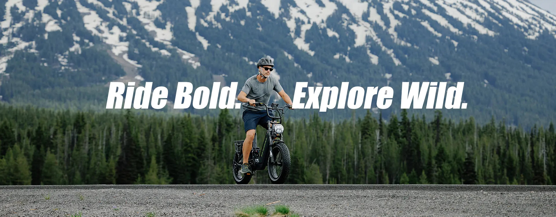 A cool guy riding his Jumper Go 20" Full Suspension All Terrain Electric Bike in the mountains