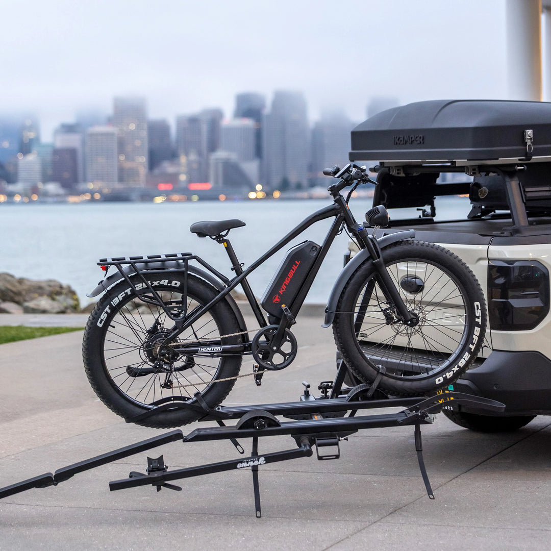 Kingbull Hunter 2.0S fat tire ebike mounted on a truck bike rack ready for an outdoor camping trip.