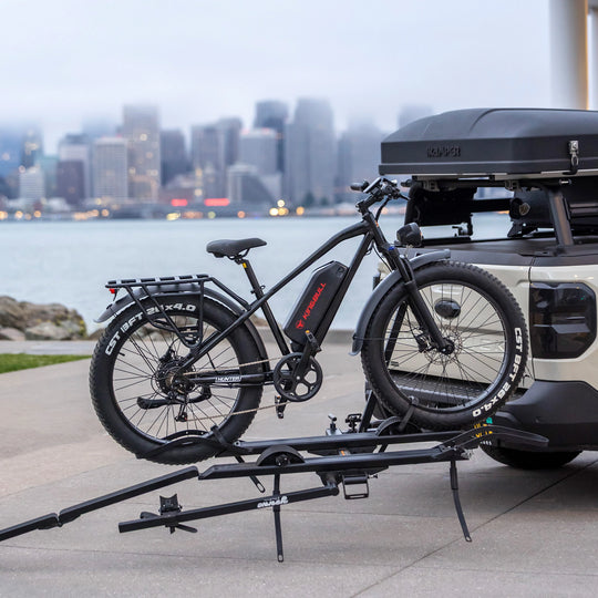 Kingbull Hunter 2.0S fat tire ebike mounted on a truck bike rack ready for an outdoor camping trip.
