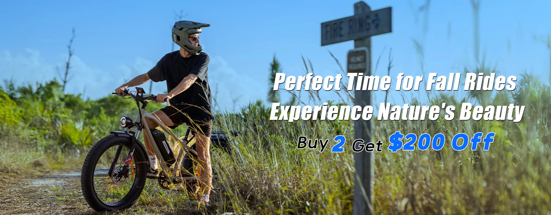 Man riding Kingbull Hunter 2.0 electric fat tire bike on rural trail - Perfect Time for Fall Rides promotion Buy 2 Get $200 Off