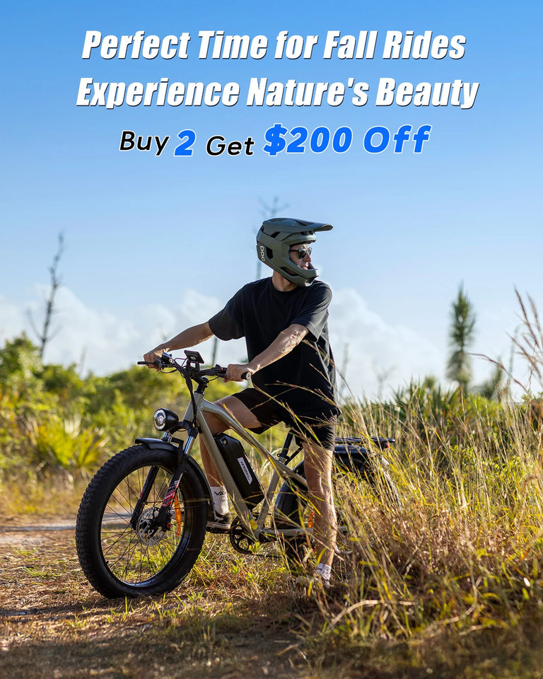 Man riding Kingbull Hunter 2.0 electric fat tire bike on rural trail - Perfect Time for Fall Rides promotion Buy 2 Get $200 Off