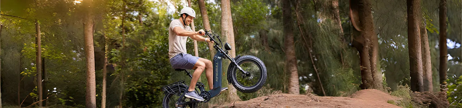 A man happily rides a Kingbull Jumper Go electric bike in the woods