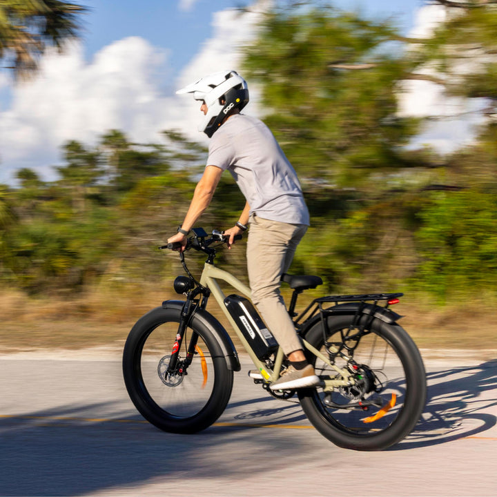  A man cyclist riding Kingbull Hunter 2.0 electric mountain bike on the path