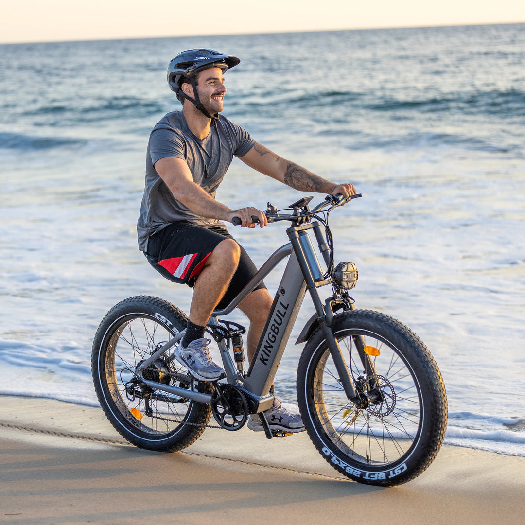 A man riding the Kingbull Rover Ebike on the beach
