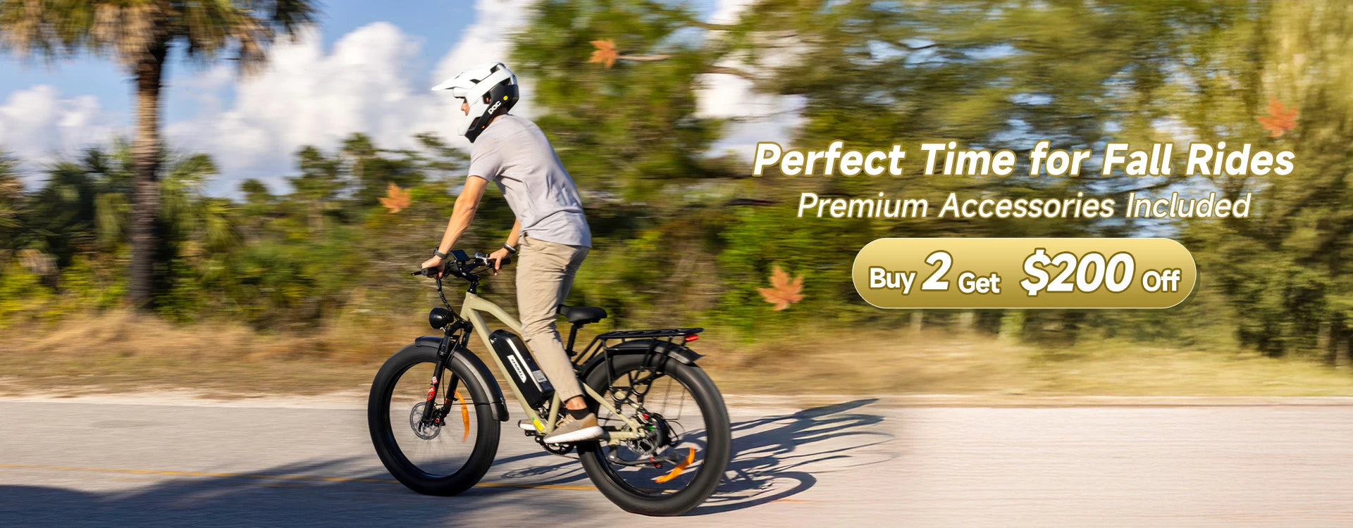 Fall bike promotion banner showing cyclist in white helmet riding the Kingbull Hunter 2.0 electric bike on road with motion blur, featuring text 'Perfect Time for Fall Rides' with premium accessories included and Buy 2 Get $200 Off offer