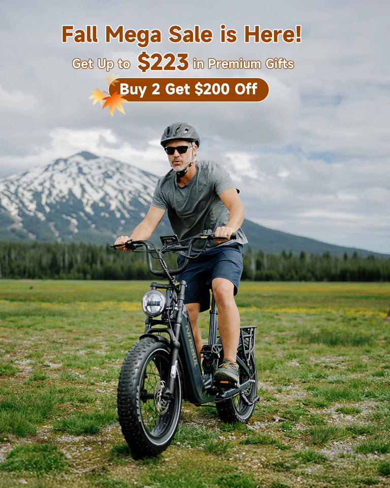 Fall Mega Sale promotion - Man riding the Kingbull Jumper Go e-bike in mountain meadow with snow-capped peaks, featuring up to $223 in premium gifts and buy 2 get $200 off deal