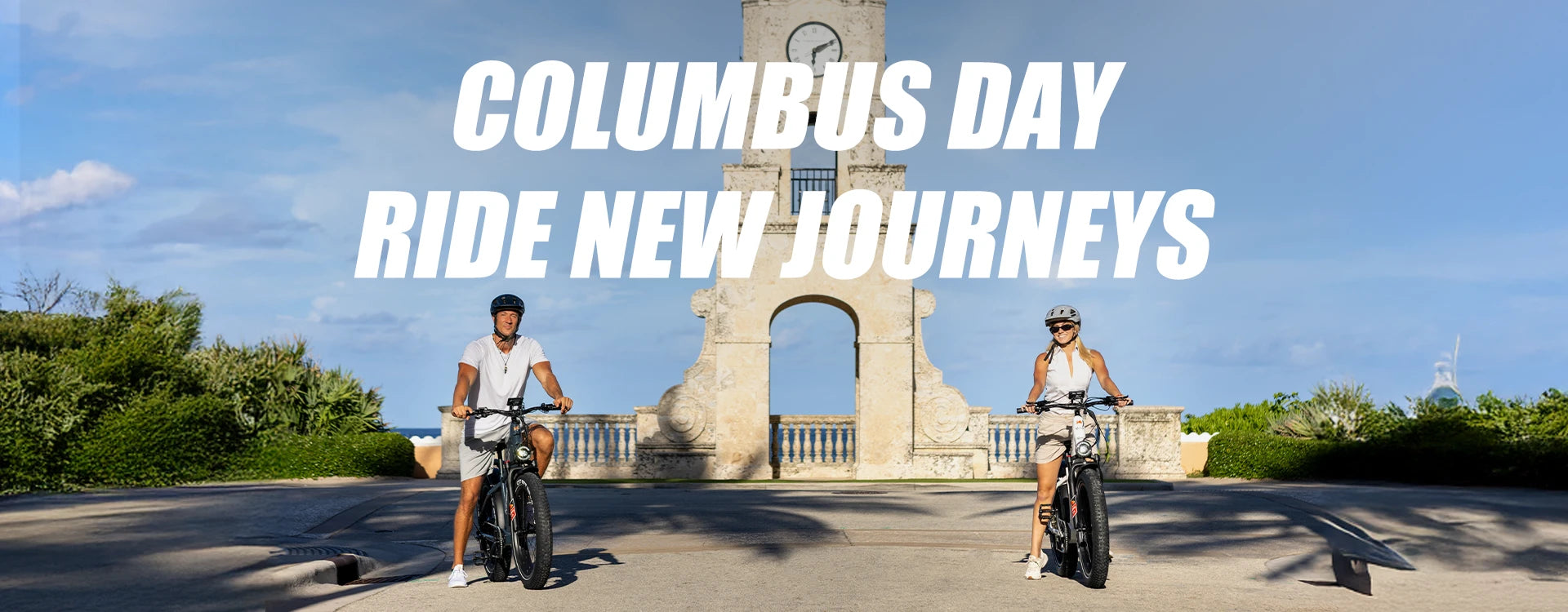 Two riders on Kingbull Disocver 2.0 and Discover ST 2.0 electric bikes at historic monument for Columbus Day Ride New Journeys promotion