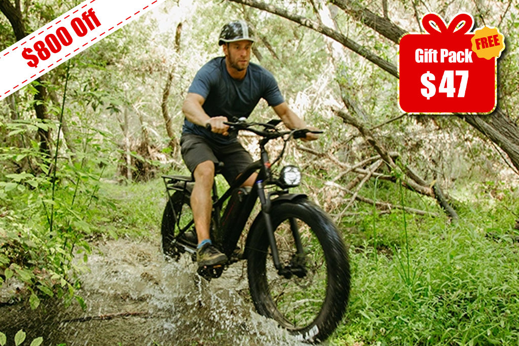 Man riding a Kingbull Black hunter 2.0S bike through water in a forest with promotional text overlay